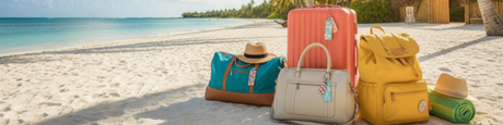 Stylish luggage, duffel, and backpack in coral, teal, and yellow on a tropical beach, perfect for 2026 summer vacations.