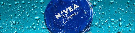 NIVEA Creme collection: iconic blue packaging, water droplets, fresh and hydrating skincare.