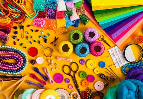 Vibrant collection of bulk art and craft supplies: beads, felt, threads, buttons, and tools for creative projects.